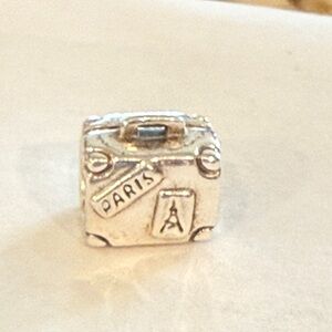 Pandora sterling silver travel suitcase.